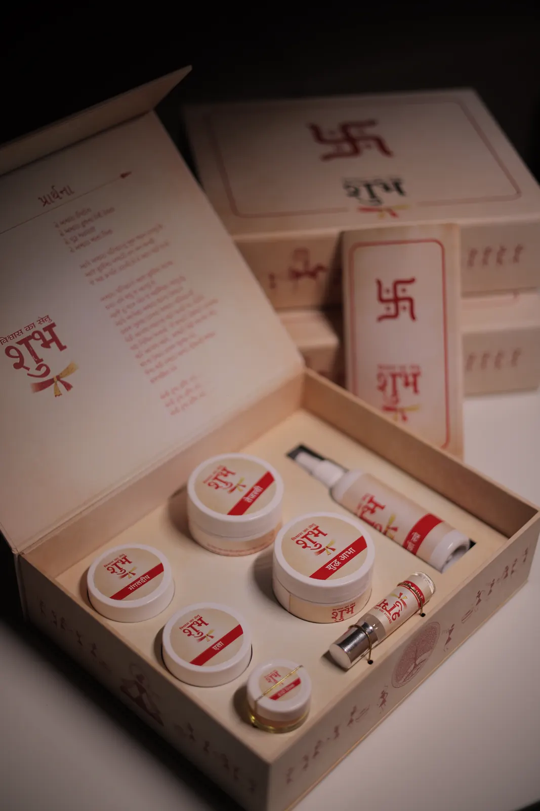 Close view of the Shubh Kit contents — labelled jars and a spray bottle seated in the box